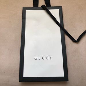 Gucci shopping bag with fabric handles.